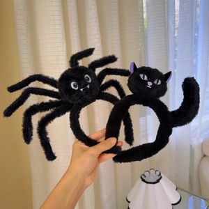Detail of plush black spider and cat headbands for Halloween party and costume props