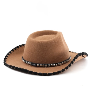 Detail of western wool hat featuring silver metal studs and black stitched brim