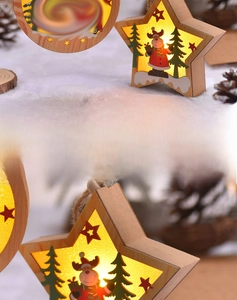 Detailed view of wooden Christmas ornaments with warm LED lights and reindeer carvings