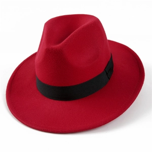 Detailed view of a red felt fedora hat featuring a classic black grosgrain ribbon band