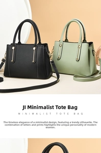 Detail of minimalist leather tote bags in black and mint green with gold metal accents