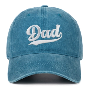 Close-up of Dad embroidery on washed blue cotton baseball cap with detailed stitching