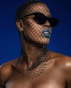 Detail view of black mesh headpiece featuring sparkling rhinestones on high elastic netting