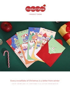 Close-up of festive 3D Christmas cards with Santa and reindeer illustrations and envelopes
