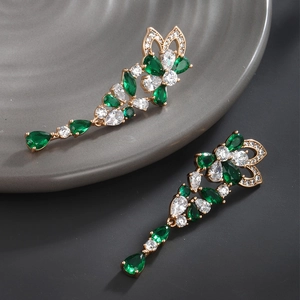 Detail of emerald drop earrings with sparkling green and white zircon stones