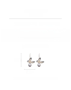 Detailed view of butterfly earrings with grey tulle wings, pearls and crystal accents