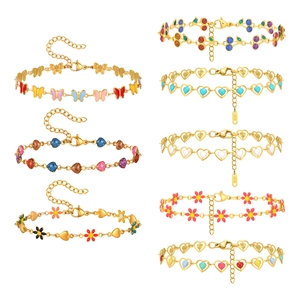 Gold stainless steel bracelet set with colorful enamel heart butterfly and floral charms