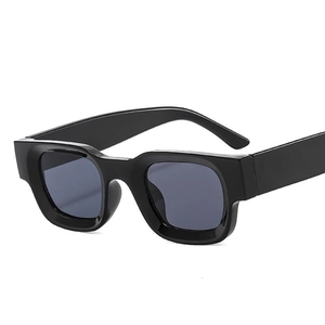 Retro black square sunglasses with thick frames and dark grey lenses for a punk style