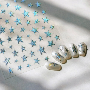 3D silver foil star nail stickers with holographic glitter effect on white manicure tips