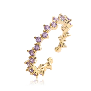 Adjustable 18K gold plated ring with purple cubic zirconia stones on white background
