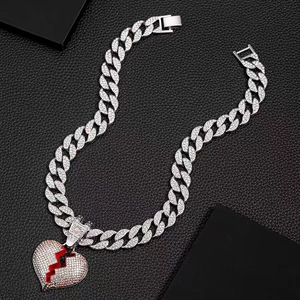 Silver Cuban link necklace with iced out broken heart pendant on black leather