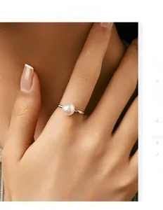 Detail of elegant S925 sterling silver ring featuring a single white crystal pearl