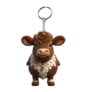 Macro view of 3D cartoon highland cow keychain with textured brown fur and metal ring