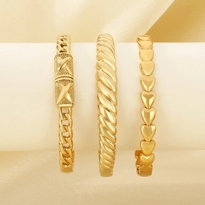 Three-piece gold titanium steel bracelet set featuring heart, twist, and Cuban link designs