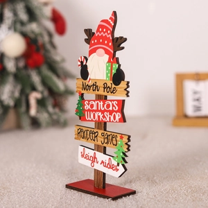 Detail view of wooden Christmas North Pole sign ornament with gnome and festive motifs