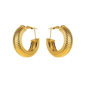 Detail of gold C-shaped hoop earrings with a textured snake scale pattern and polished finish