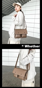 Detail of a brown leather messenger bag featuring double front pockets and metal rivets