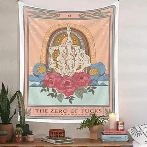 Detail of tarot-style tapestry featuring rose motifs and bold artistic lettering