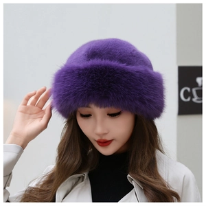 Close-up of a purple faux fur winter hat with thick plush texture and warm round dome