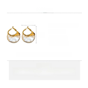 Detailed specs of baroque pearl earrings with gold alloy frame and silver needles