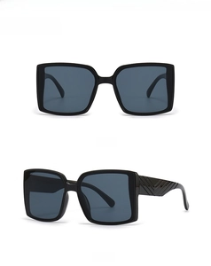 Detailed front and side views of black square oversized sunglasses with textured temples