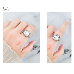 Detailed views of a French retro silver ring featuring an irregular baroque pearl