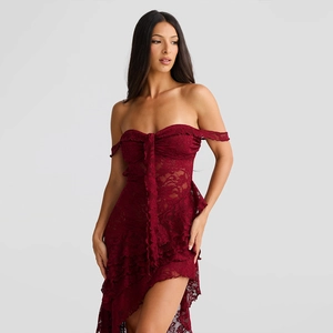 Close-up of elegant burgundy lace fabric with floral patterns and ruffled hem detailing