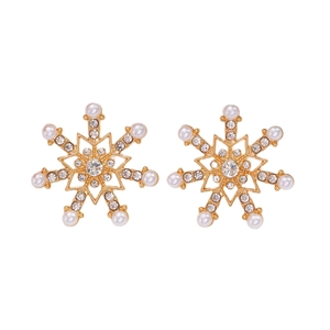 Macro detail of snowflake stud earrings with white pearls and sparkling rhinestones