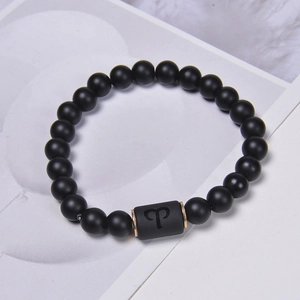 Black agate and volcanic stone beaded Aries zodiac bracelet with gold metal accents