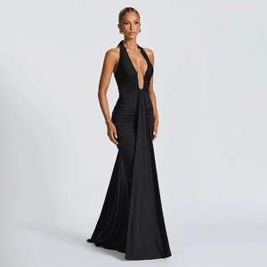 Detail of elegant black deep V-neck halter maxi dress with ruched waist and fishtail hem