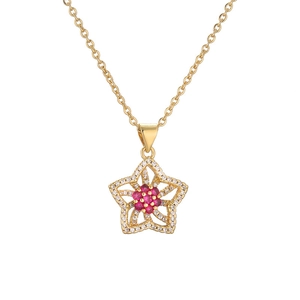 Gold plated necklace with star pendant and red gemstone flower centerpiece