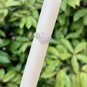 Golden 18K gold plated ring featuring three heart-shaped zircons on a white display