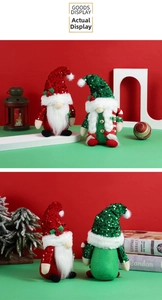 Detail of Christmas gnomes with sequined hats and candy canes for festive decor