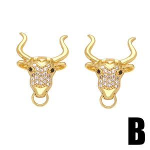 Golden bull head stud earrings with white cubic zirconia accents on a clean white background