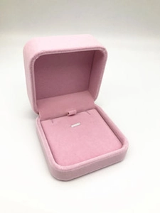 Close-up of a pink velvet jewelry gift box with a slot for rings or stud earrings