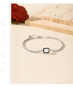 Detailed view of S925 silver tennis bracelet with black enamel and rectangle crystal