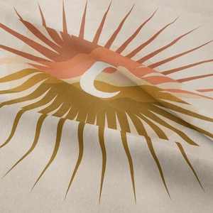 Close-up of bohemian wall tapestry showing fine fabric texture and sun pattern print