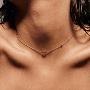 Gold stainless steel angel number 444 necklace shown on neck for jewelry styling