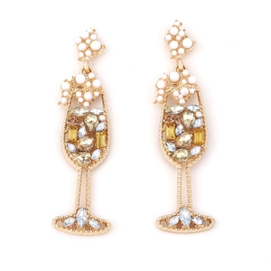 Macro detail of champagne glass earrings with gold alloy, white pearls and sparkling crystals