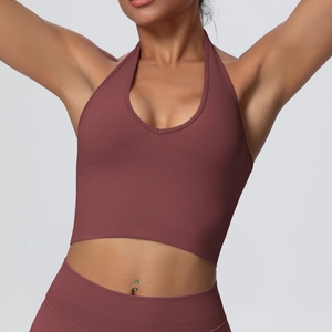 Detail showing vertical ribbed texture of a dusty rose halter neck sports yoga bra