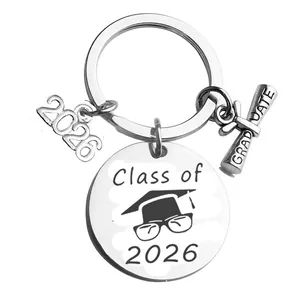 Polished stainless steel Class of 2026 graduation keychain with multiple charms on white background