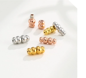 Detailed view of gourd-shaped spiral clasps in gold, silver, and rose gold for DIY jewelry