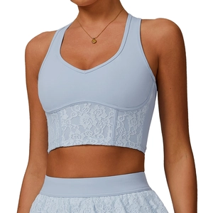 Light blue V-neck yoga sports bra with intricate lace hem and matching fitness leggings