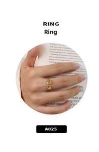 Detail of 18K gold-plated stainless steel ring featuring symmetrical leaf design on model