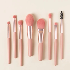 Professional 8-piece mini makeup brush set with pink handles and rose gold ferrules