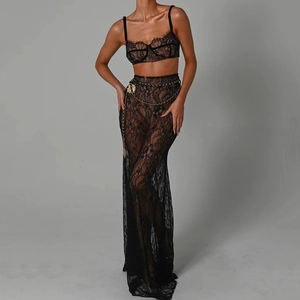 Detailed view of black lace two-piece evening set with a stylish golden chain waist belt