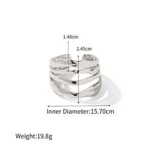 Detail view of multilayer irregular wave ring in polished silver stainless steel