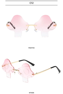 Detail view of pink gradient mushroom sunglasses with thin golden metal temples