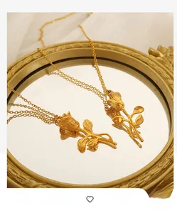 Close-up of golden vintage rose pendants on a retro mirror with detailed petal textures