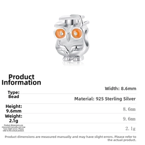 Macro detail of S925 sterling silver owl bead with orange eyes and graduation cap